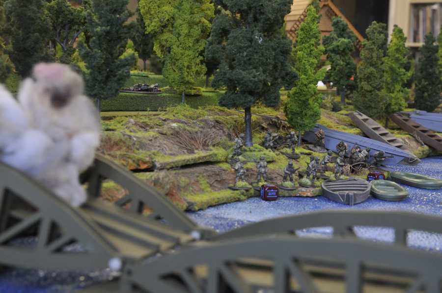 US forces under fire board boats for the river crossing